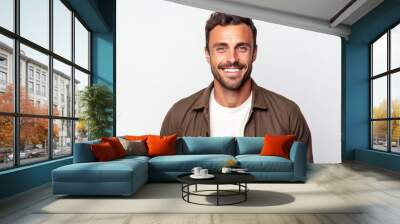 Portrait of a happy young man looking at camera on a white background Wall mural