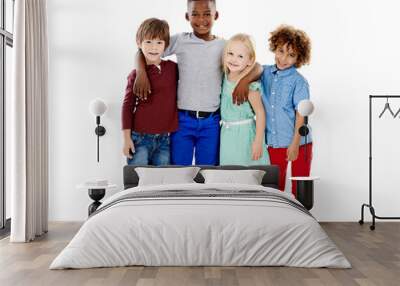 Embracing diversity. Studio shot of a group of young friends standing together against a white background. Wall mural