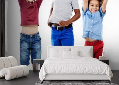 Students, jumping and portrait of children in studio for diversity, friends and playing. Happiness, youth and smile with group of kids isolated on white background for celebration, playful and energy Wall mural