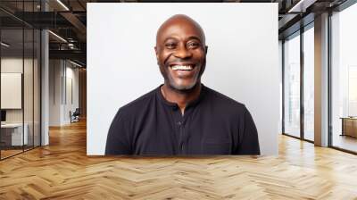 Portrait of a happy african american man smiling against white background Wall mural