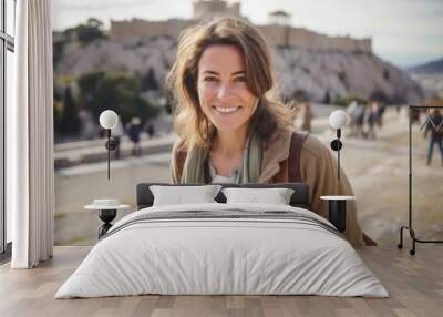 Portrait of a smiling young woman with a backpack on the background of the Acropolis in Athens, Greece Wall mural