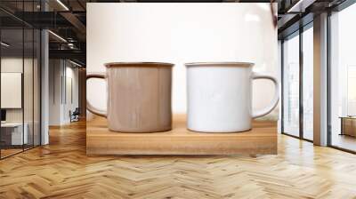 Brown and white coffee mugs on wooden table, cozy cute design in lovely home background Wall mural