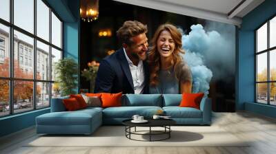 Happy couple having a gender reveal party. blue smoke grenade outdoors. It's a boy. Gender reveal party concept. Couple in love Wall mural