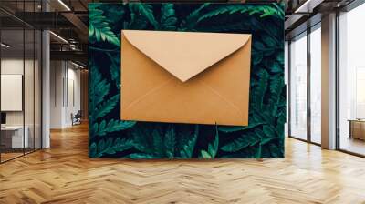 Blank envelope and green leaves in nature, paper card as background, correspondence and newsletter Wall mural