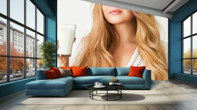 Diet, health and wellness concept, woman holding glass of milk or protein shake cocktail Wall mural