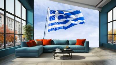 Greek flag and cloudy sky in summer day, politics of Europe Wall mural