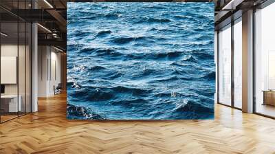 Sea, texture and coastal nature concept. Blue ocean water as surface background, flowing waves and summer holiday travel. Wall mural