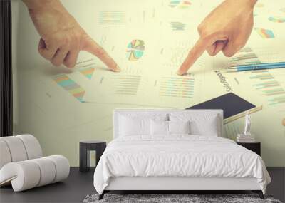 Image of male hand pointing at business document during discussi Wall mural