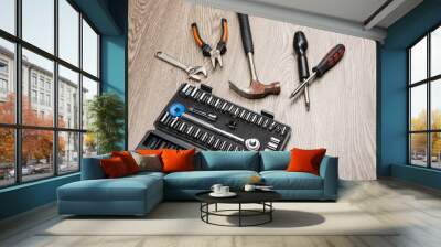 The repair tools is placed on the wooden table. Wall mural