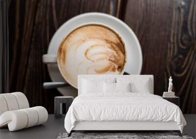 Cup of coffee latte on old wooden background Wall mural