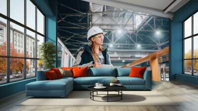 Young female engineer of large industrial plant Wall mural