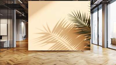 Beige background with shadow and palm leaves Wall mural