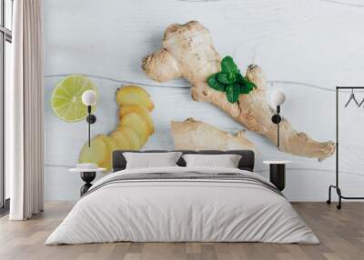 Ginger and lime on a wooden table Wall mural