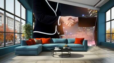 Business handshake. Two business people shaking hands in the office.Successful business people handshaking closing a deal.Business People Shaking Hands Agreement Concept.Lighting color effect. Wall mural