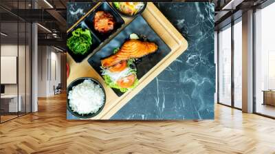 Japanese food mix on a  black stone table.top view composition. Wall mural