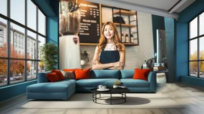 Portrait young Asian woman barista feeling happy smiling at urban cafe. Small business owner Korean girl in apron relax toothy smile Wall mural