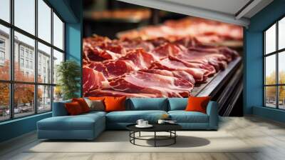 Meat processing plant. Slices of fresh bacon and mint slices on a conveyor belt in the workshop. Arrival of jamon or cold cuts. Production of pork or beef in a modern enterprise. Wall mural