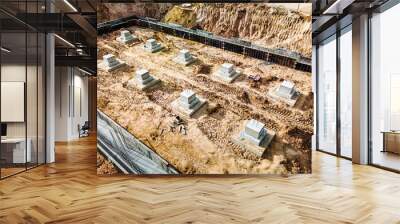 Monolithic reinforced concrete foundations or grillages for the construction of a large modern residential building. Rostverk at the construction site. Foundation for the building. View from above. Wall mural