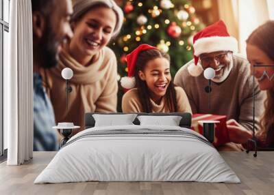 Photo of people gathered around a Christmas gift in anticipation Wall mural