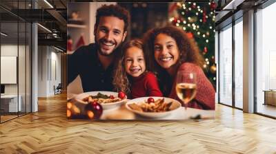 Winter holidays and people concept - happy family at the table celebrating christmas and new year. Home holiday. Blurred background. Selective focus. Wall mural