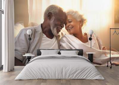 You are the beautiful part of my life. Happy elderly dark-skinned couple cuddling in bed. Romantic feelings. Love. Wall mural