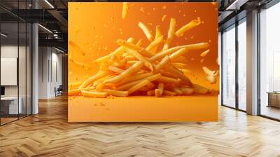 Crispy golden french fries tossed with salt, captured in mid-air with dynamic motion, highlighted by a warm, yellow background, perfect for food and snack themes. Wall mural