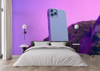 Smart phone showcase on a rock, Sleek Phone Case Mockup for Smartphone product review, purple Wall mural