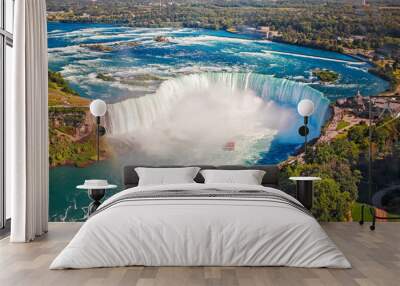 Aerial top landscape view of Niagara Falls and tour boat in water between US and Canada.  Horseshoe of famous Canadian waterfall on sunny day Wall mural