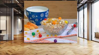 Bowl of oatmeal cereal with candies, apples, milk Wall mural