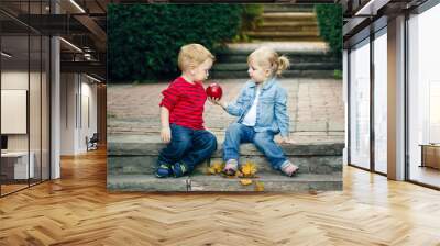 group portrait of two white caucasian cute adorable funny children toddlers sitting together sharing Wall mural