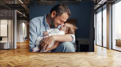 Middle age Caucasian father kissing sleeping newborn baby girl. Parent holding rocking child daughter son in hands. Authentic lifestyle parenting fatherhood moments. Single dad family home life. Wall mural