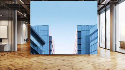 Two modern buildings with glass windows. Architecture design of buildings. Wall mural