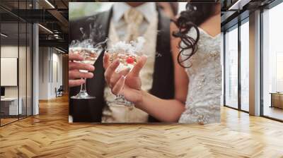 Champagne glasses. Wedding slide champagne for bride and groom. Colorful wedding glasses with champagne. Catering service. Catering bar for celebration. Beauty of bridal interior for wedding Wall mural