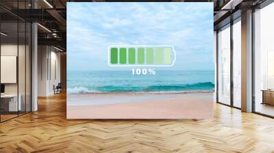 Fully charge battery 100% sign icon on natare summer beach on vacation day. Holiday long weekend relax time. Wall mural