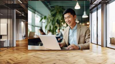 Man working with computer laptop on blur office background. Wall mural