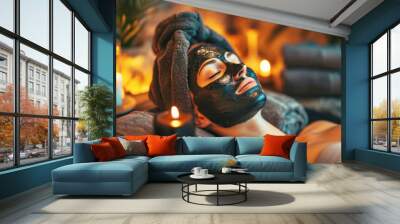 Woman customer indulges in rejuvenating with charcoal face cream massage in spa. Wall mural