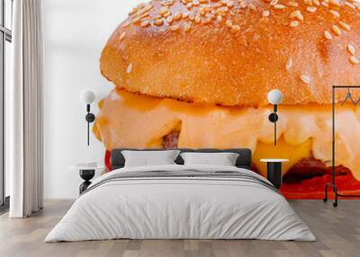 Delicious burger with melted cheese dripping over toppings on white background Wall mural