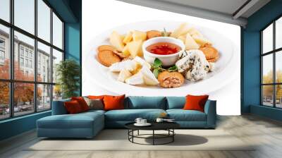 Delicious cheese plate presenting variety of cheeses, nuts, and sauce Wall mural