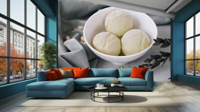 Pistachio ice cream scoops on a bowl Wall mural