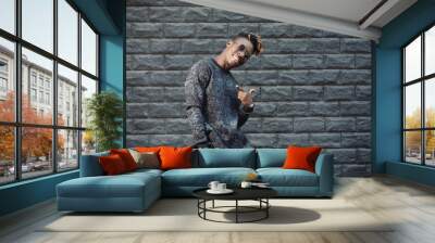 African american man model wear stylish fashionable pullover standing against brick wall Wall mural