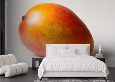 A single ripe mango, its rich yellow-orange skin glowing. Wall mural