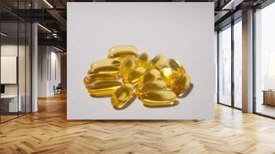 Fish oil capsules isolated against a white background. Wall mural