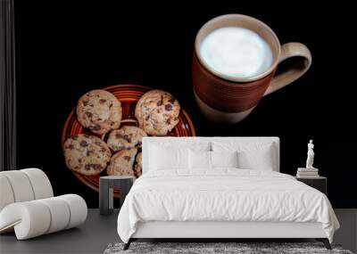 milk and cookies on black background Wall mural