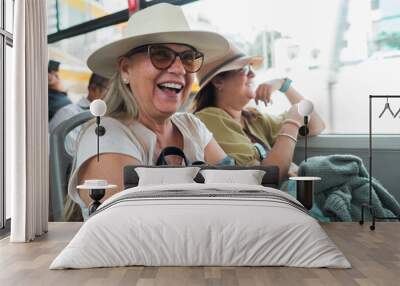 Tourists travel happy on the bus. Wall mural