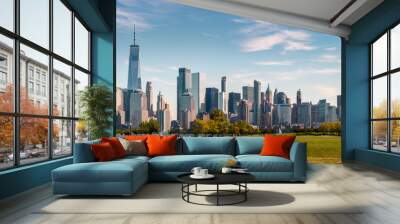 New York Skyline showing several prominent buildings and hotels under a blue sky. Wall mural