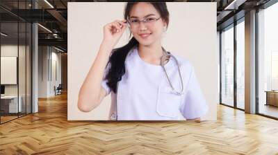 young female doctor standing and smile Wall mural