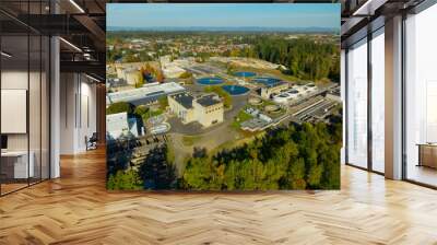 A view of a city with a large water treatment plant in the middle Wall mural