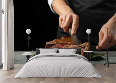 Chef, sliced with meat steak on a black background, Recipe concept for homemade food. A larger plan Wall mural