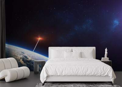 Rocket launch from the Earth planet through the clouds with a bright glow of the engine on the orbit and a bright blue nebula galaxy. Elements of this image furnished by NASA Wall mural