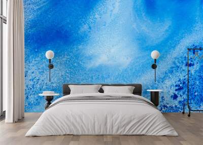 Classic blue and white watercolor paint in abstract flowing shapes for design in close-up. Background texture of unusual stains of blurry blue thick paint with sprinkles for text and lettering. Wall mural